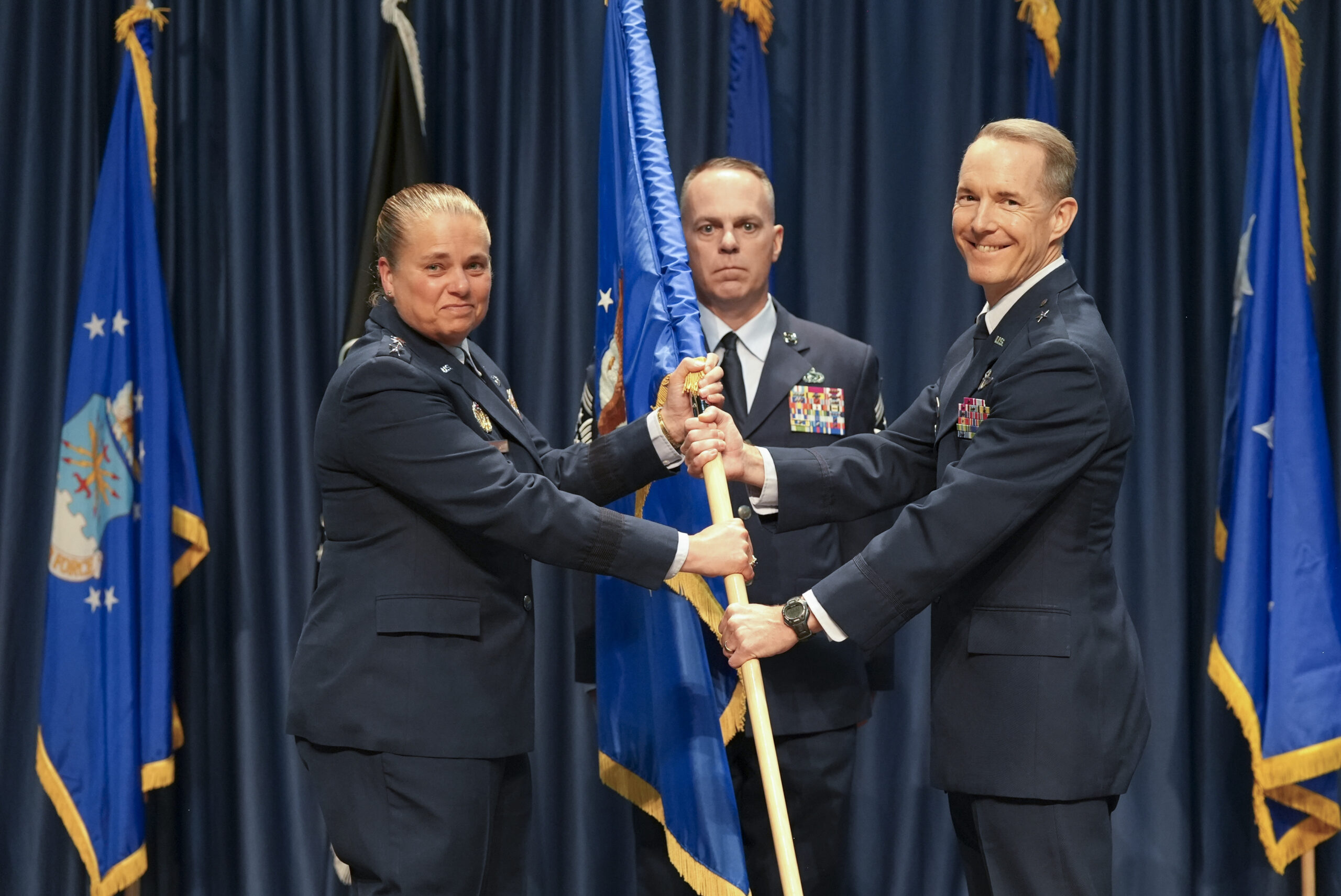 leadership passing guidon during Change of Command ceremony