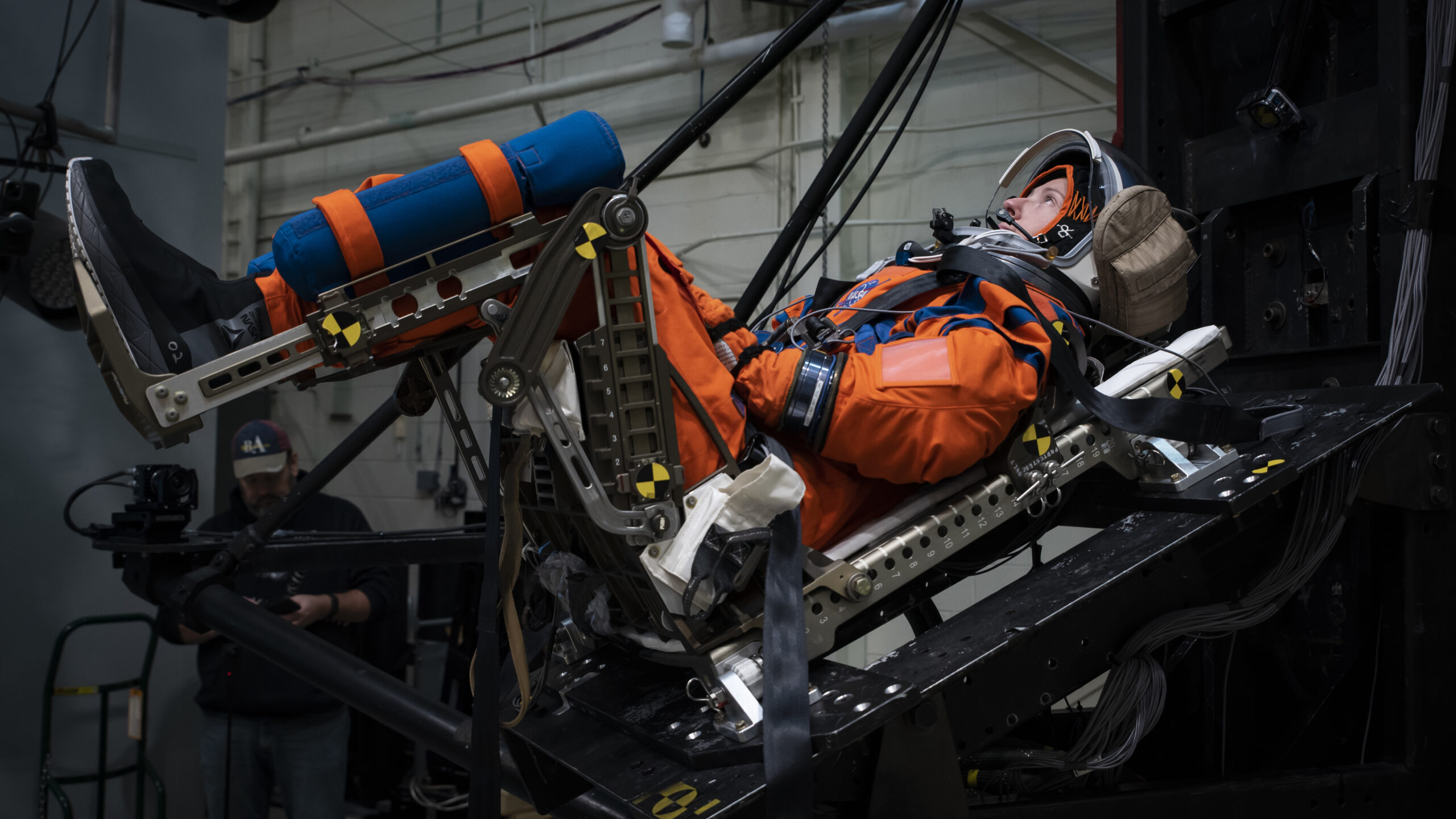 The vertical deceleration tower at Wright-Patterson Air Force Base with a U.S. Air Force volunteer strapped in testing a new space suit and seat combo for upcoming Orion spacecraft missions.